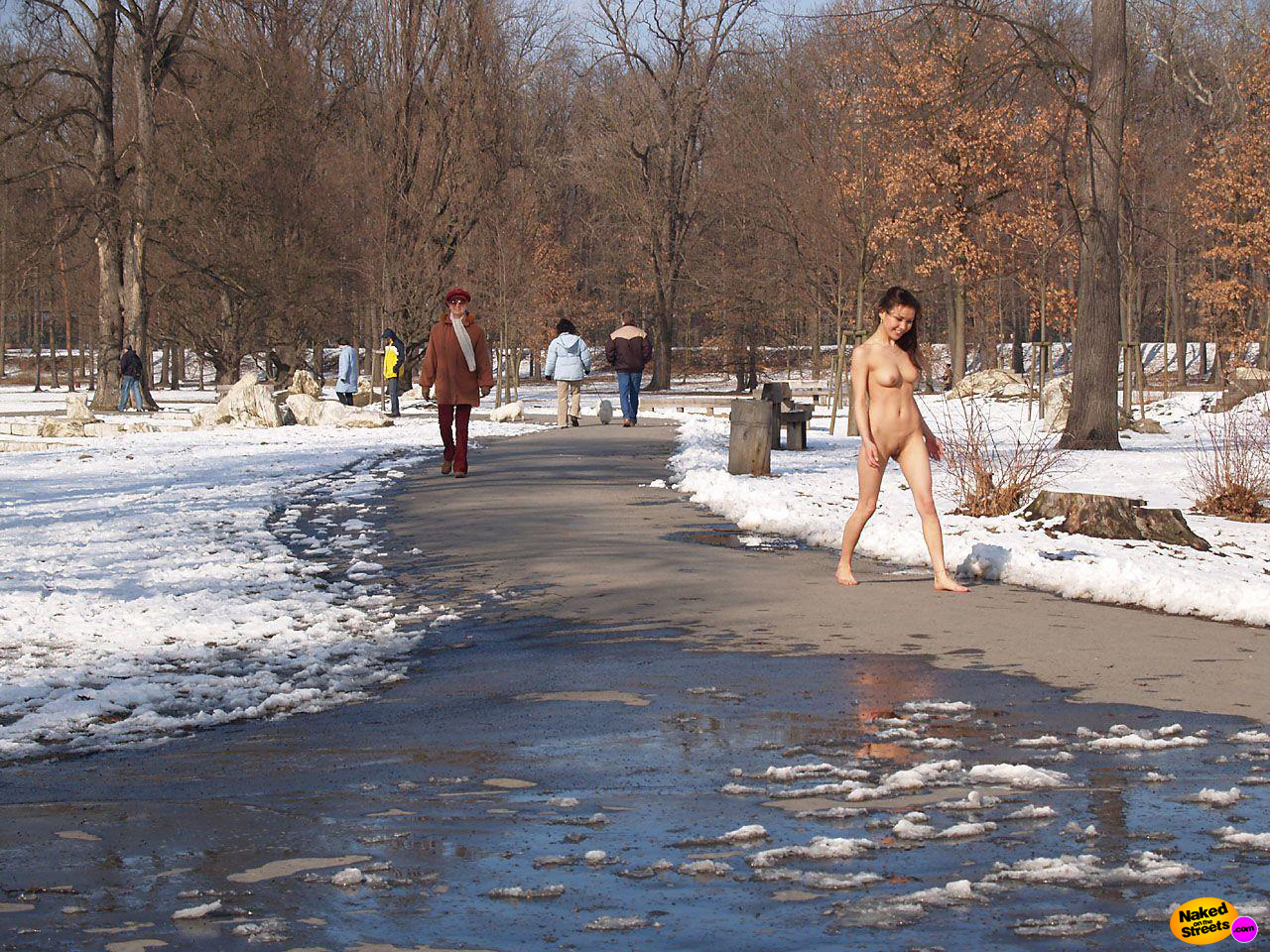 Crazy sexy Asian chick walking through a public park fully nude