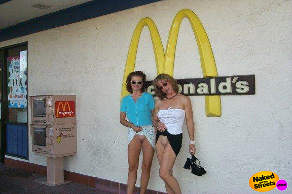 Two kinky MILFS flashing their pussies at a McDonalds Restaurant