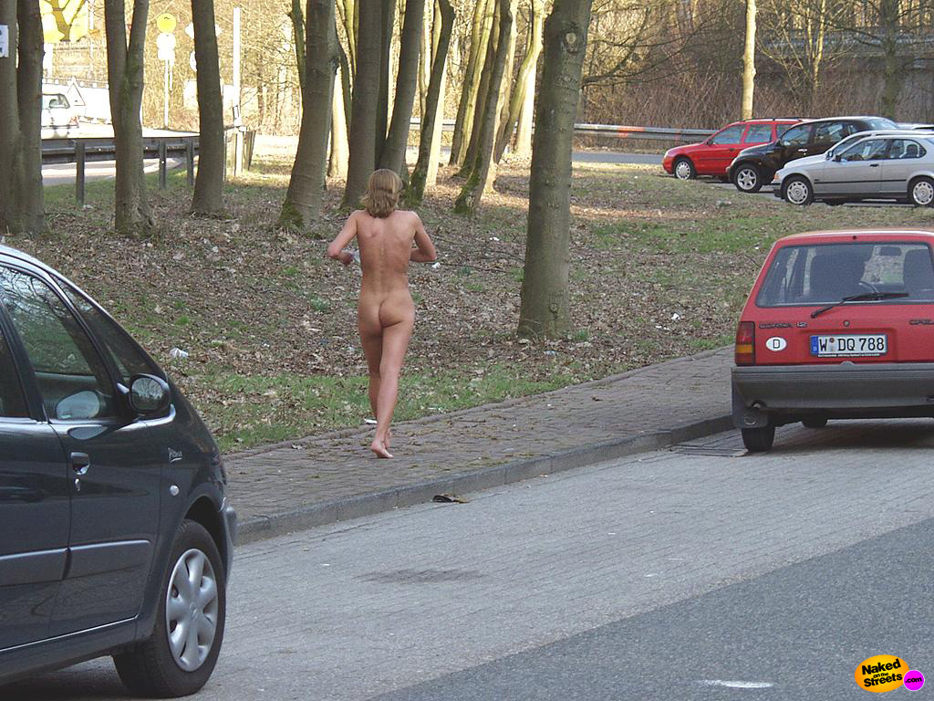 Sexy girl walks around naked at an Autobahn carpark