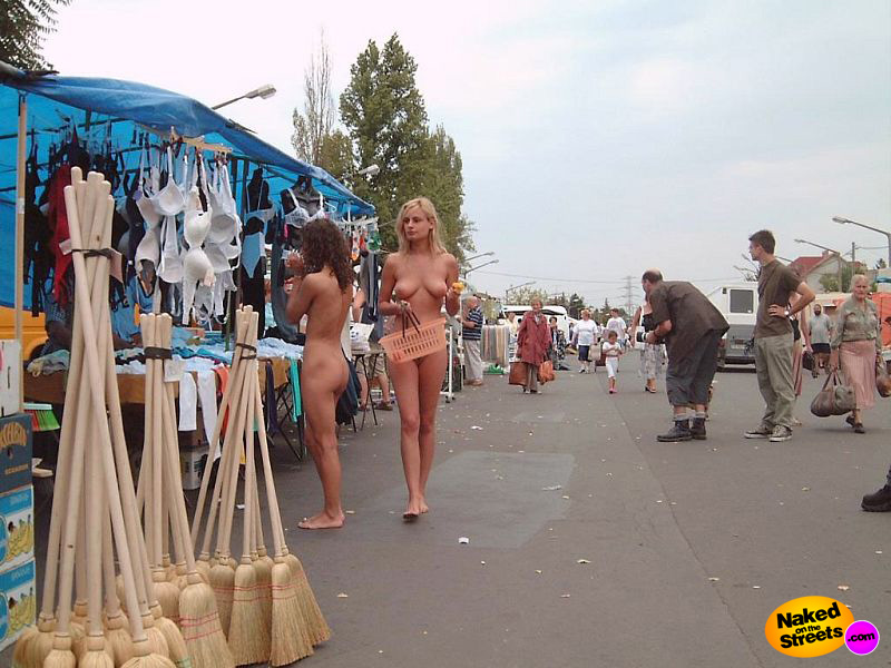 Two fully naked hot chicks going shopping at the market