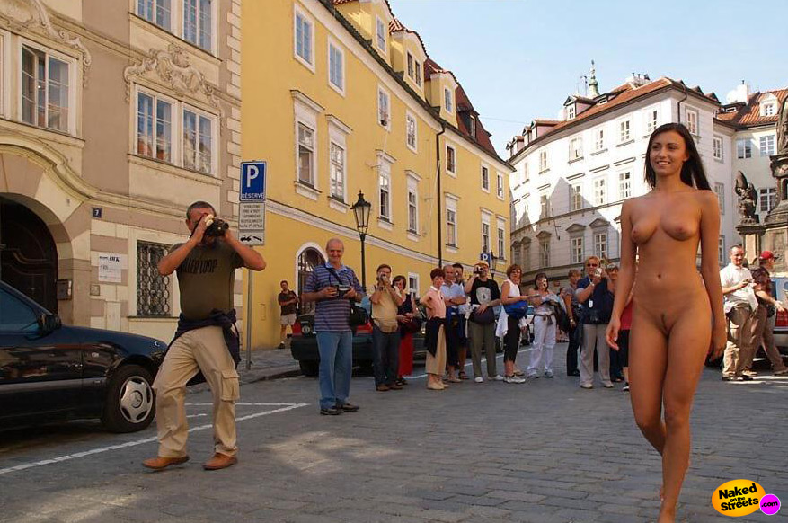 Foxy lady gets photographed and videotaped as she walks through town naked