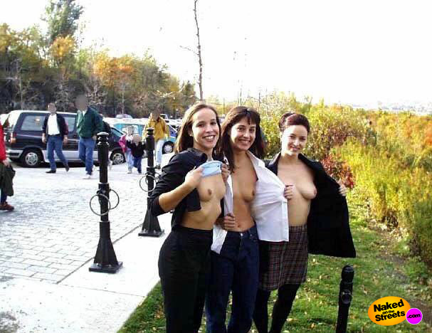 Three Latina chicks show off their titties in public