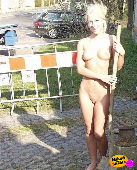 Blonde hottie tries to hide naked body behind lamp post