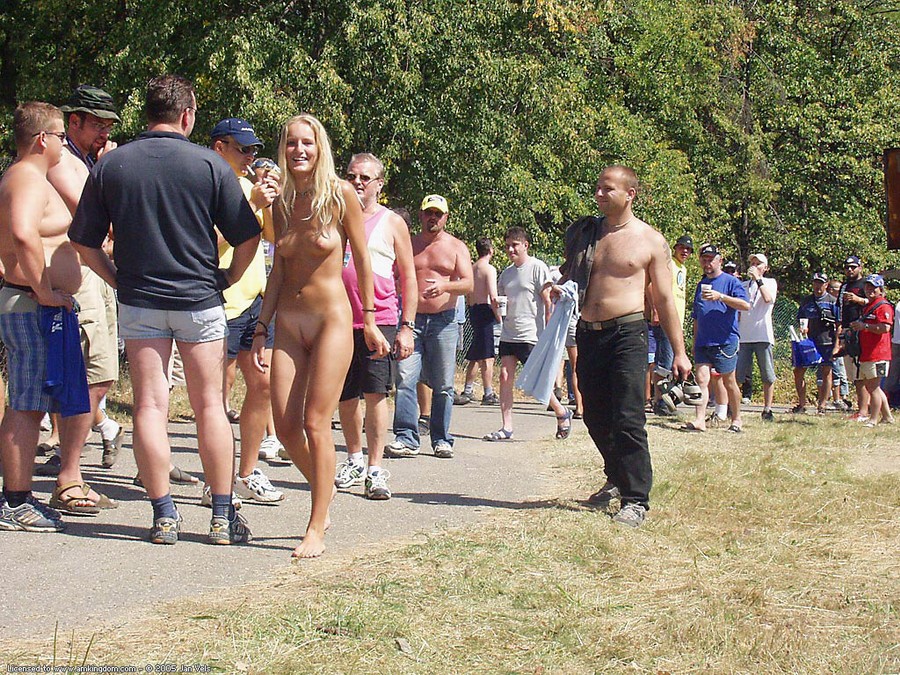 Girl walks around naked with tons of horny guys behind her