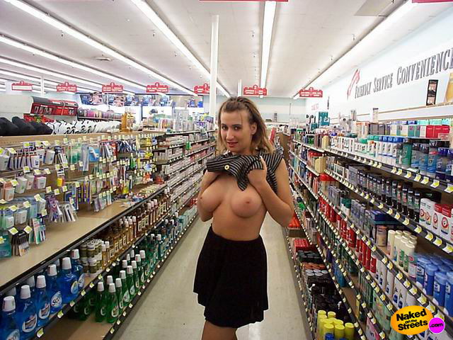 Playing with my big tits in a store