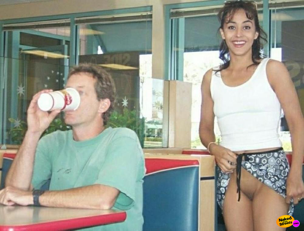 Laughing Latina shows her snatch in a fast food restaurant
