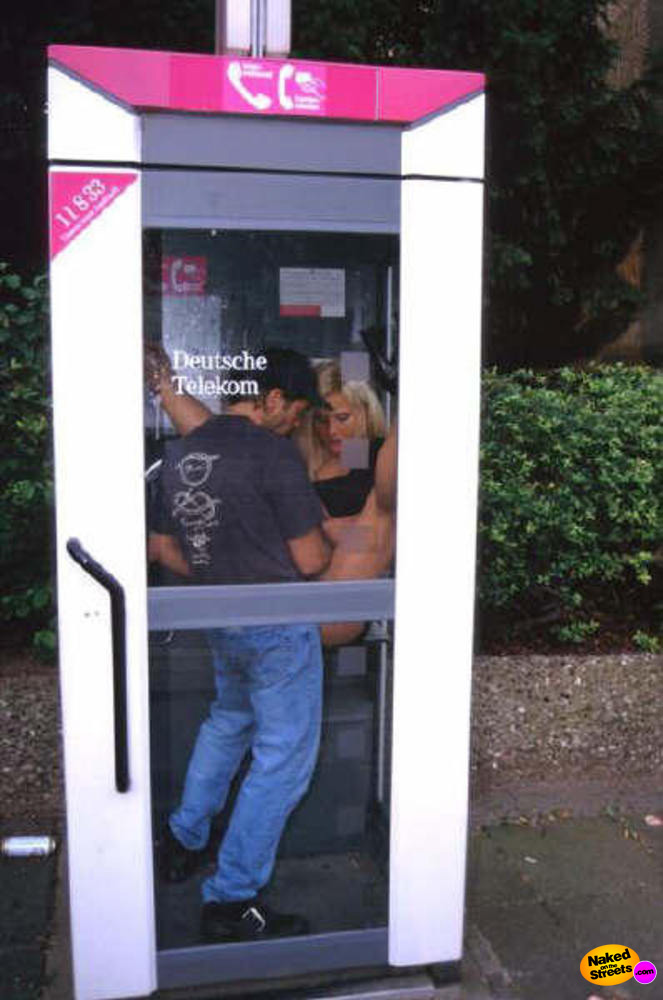 Crazy couple fucking in a telephone booth