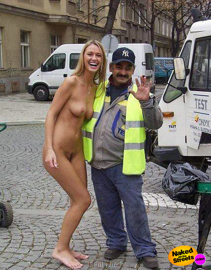 Hot chick laughs as she gets her picture taken with a street cleaner