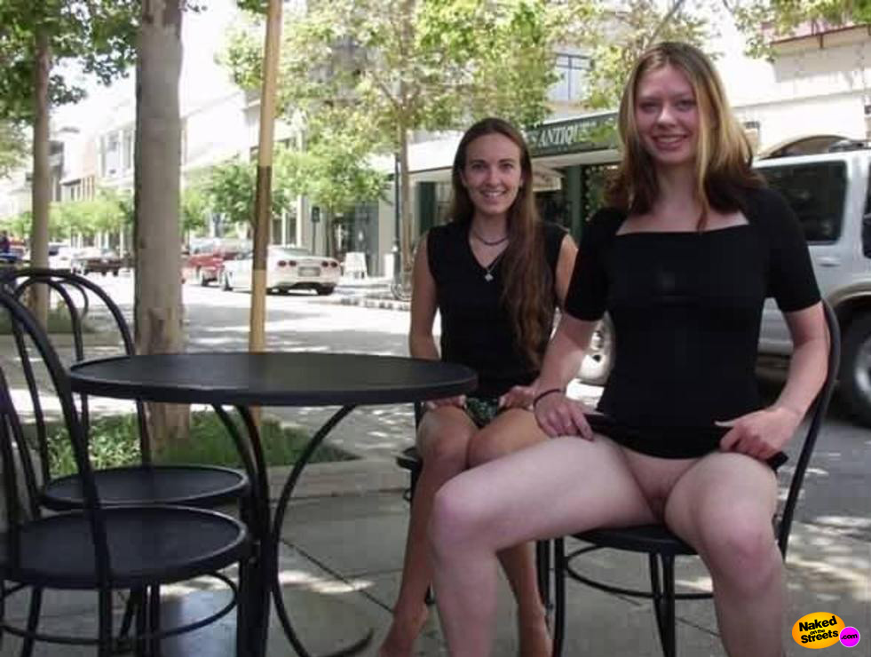 Two crazy chicks show off their snatches in public