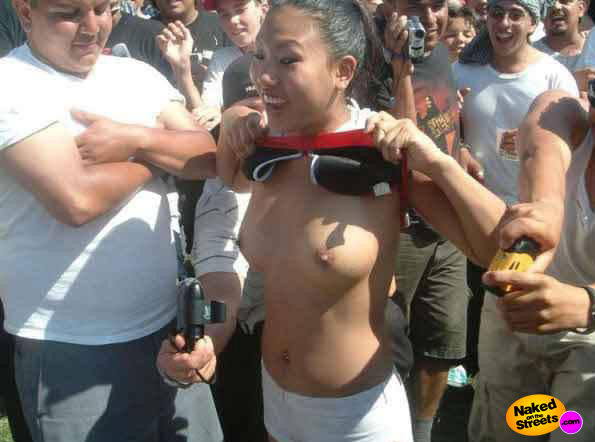 Hot Asian girl persuaded to flash her titties at a festival