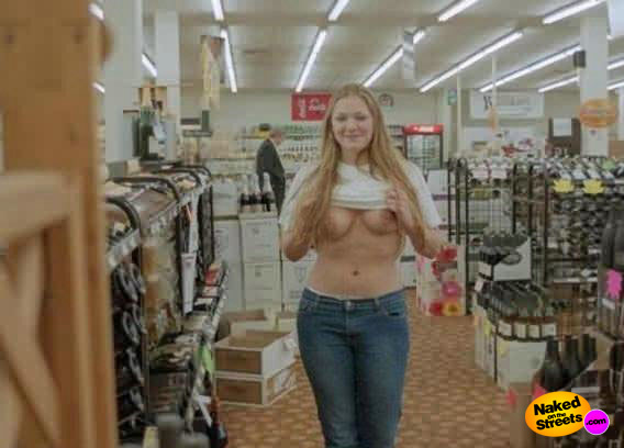 Ugly chick shows her titties in a department store