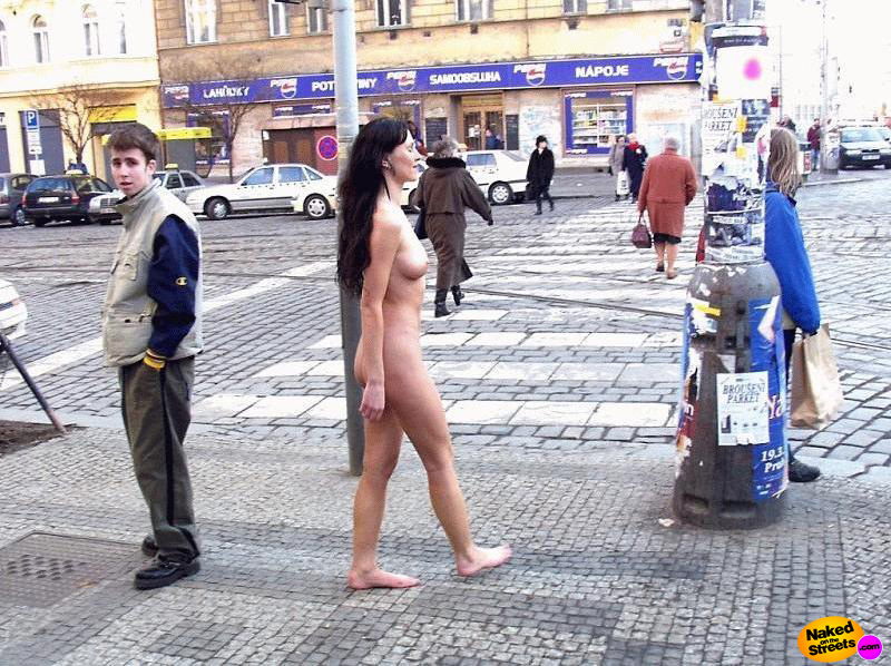 Hot black haired chick walks through town with nothing on at all!