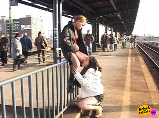 Two kinky lesbians getting nasty as fuck at a public train station