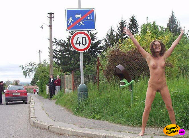Is this dumb girl really trying to mimic a traffic sign?