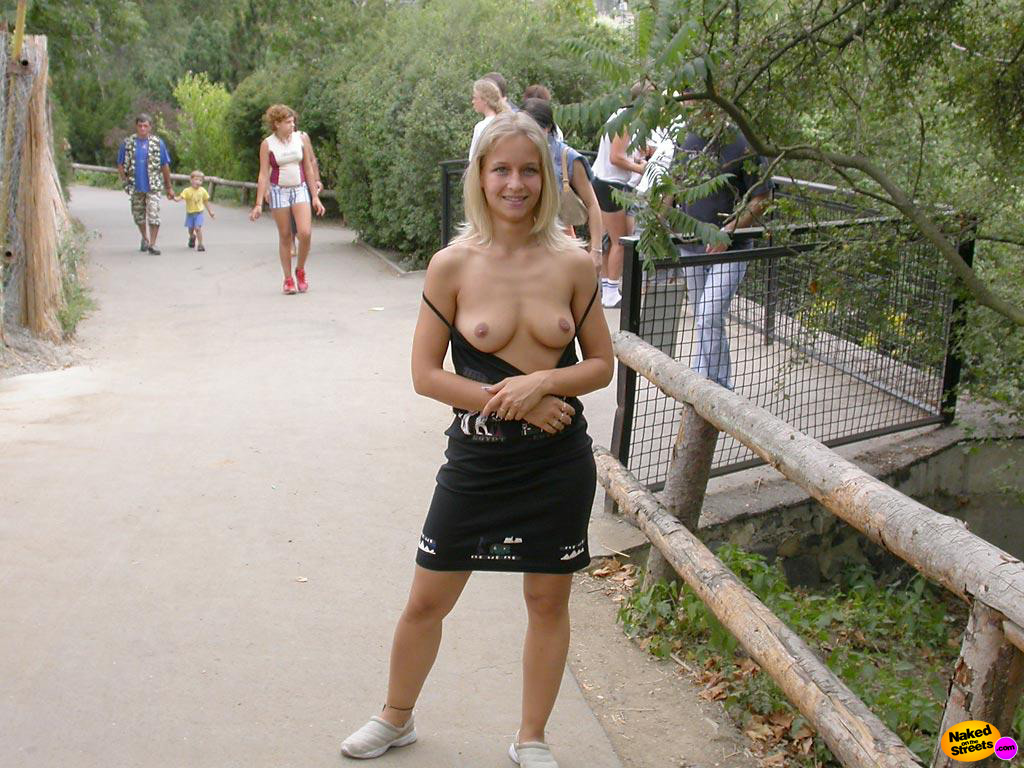 Blonde naughty teen shows her boobs in a national park