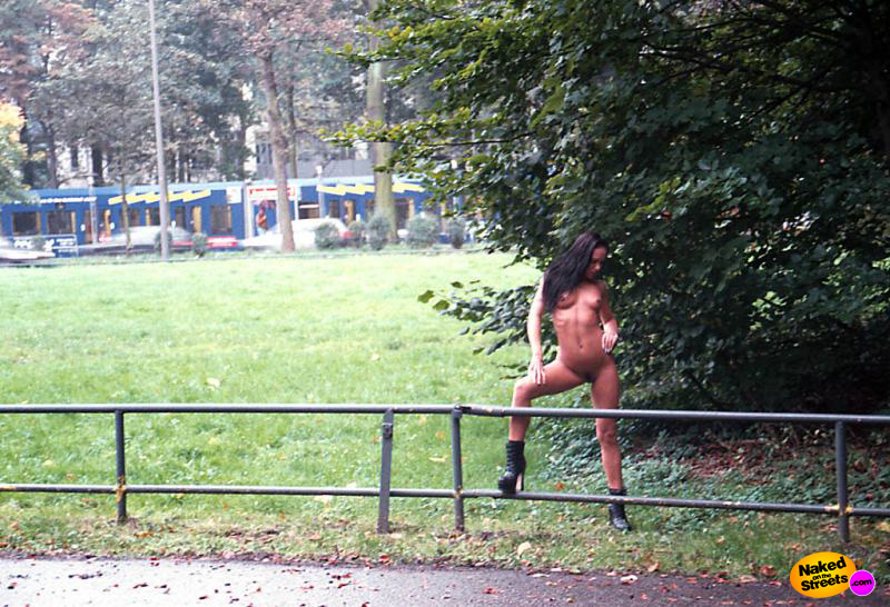 Sexy girl with ridiculous boots flashing in the park