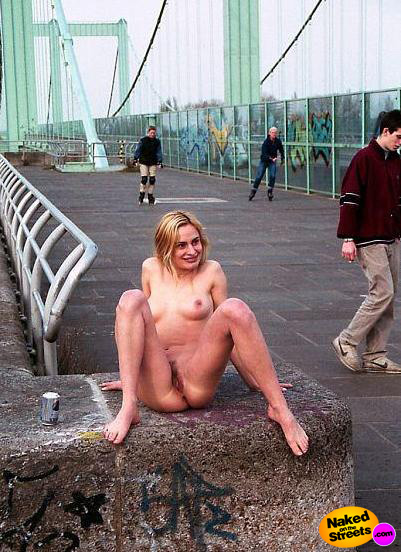 Hairy pussy chick sitting fully nude near a bridge in public