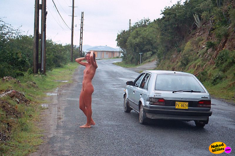 Naughty woman walks around naked on the road