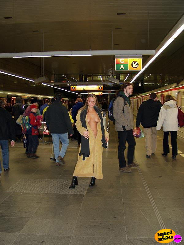 Crazy chick flashing her pretty titties in a train station