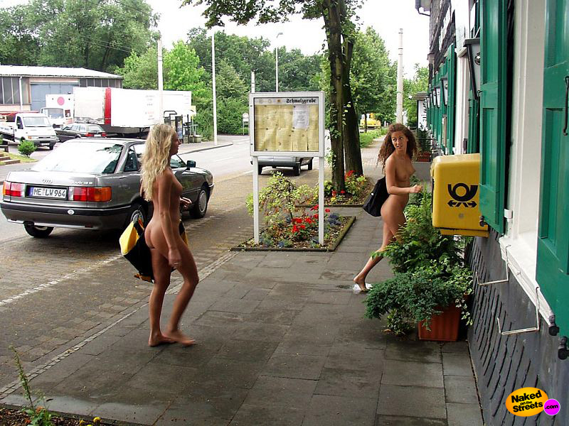 Two chicks walk around fully naked on the sidewalk