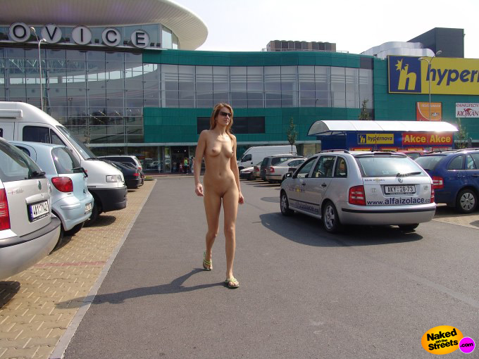 Tall thin blonde walks around fully nude at a shopping mall