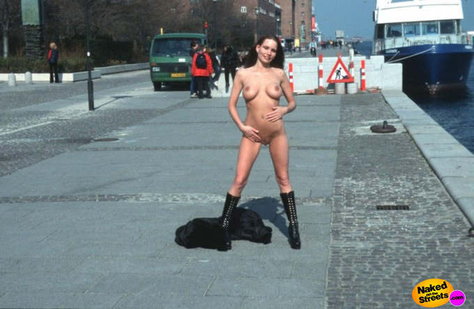 Big titted teen girl shows off her body on the sidewalk