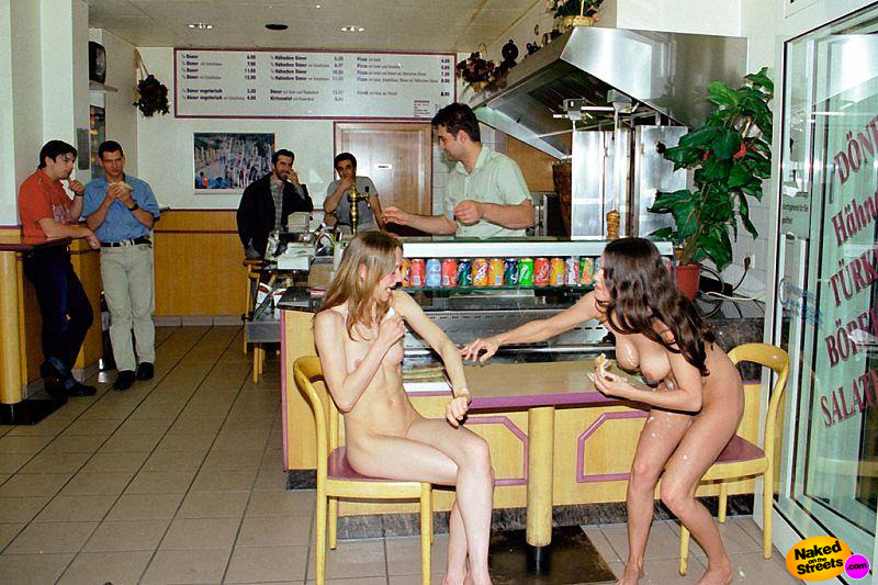 Two crazy teens totally nude in some European cafeteria