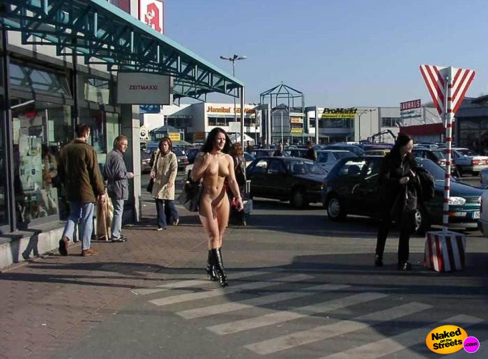 Hot chick crossing the street at some shops with no clothes on