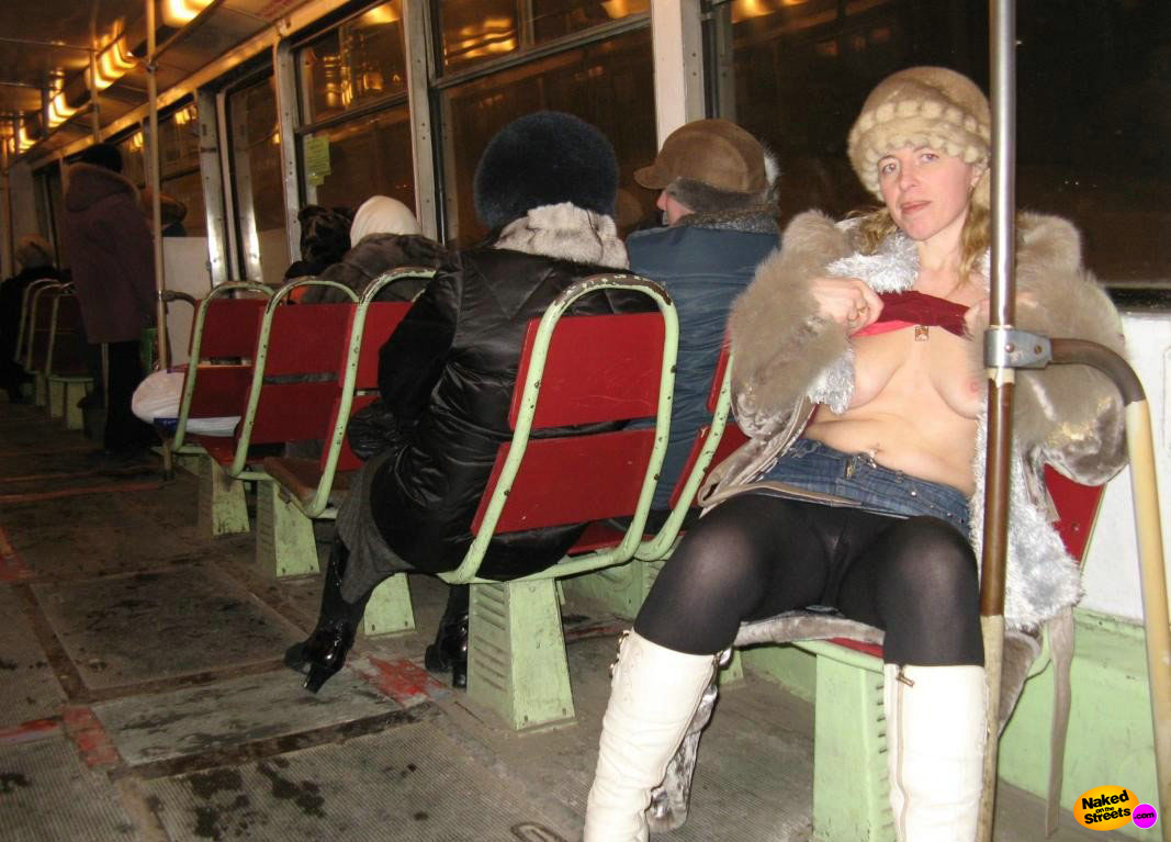 Russian slut shows off her sagging tits in public image