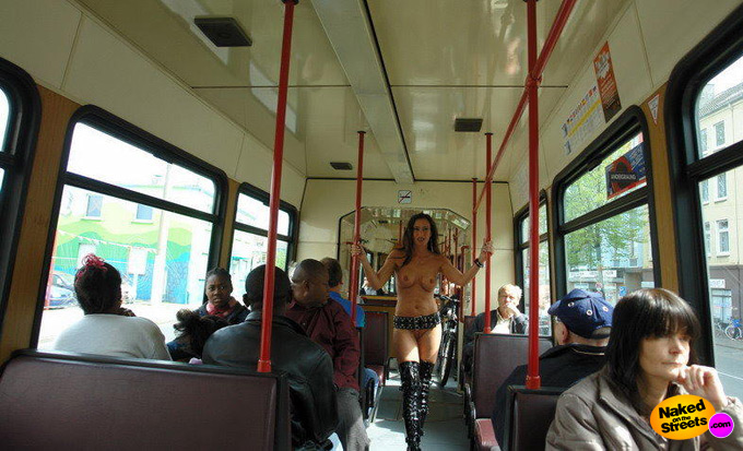 Kinky amateur slut posing fully nude in the middle of a crowded bus