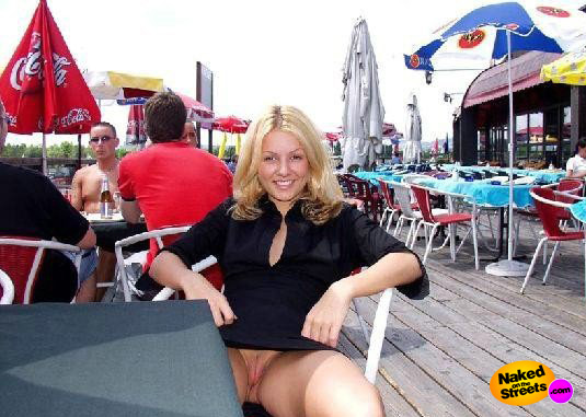 Blonde hottie shows off her snatch on a terrace