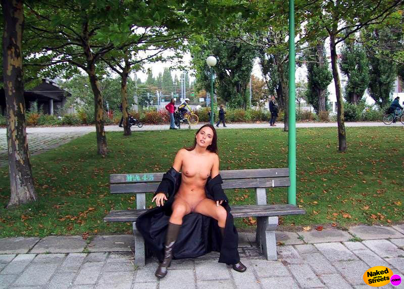 Freaky slut posing nude on a bench