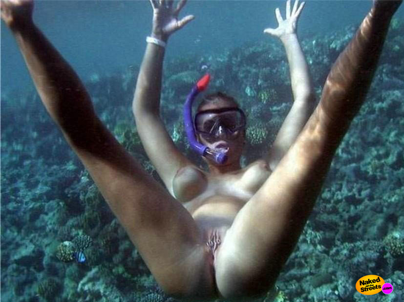 Nude couples scuba diving