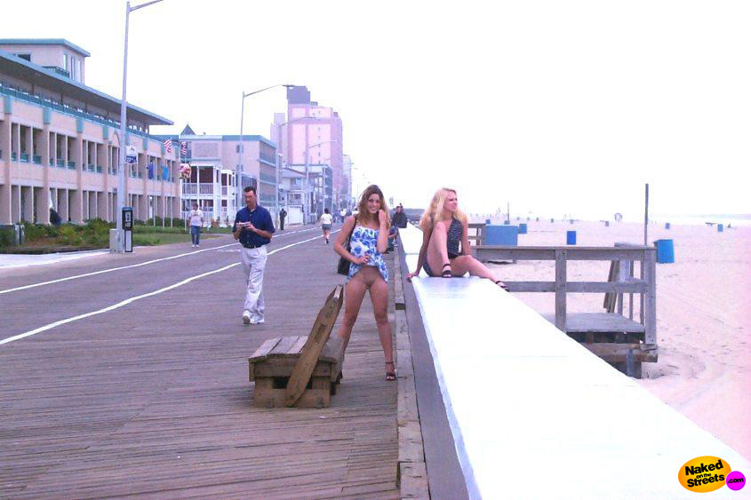Crazy teen slut flashing her pussy on the boardwalk