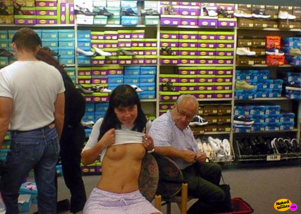 Crazy chick shows boobs in a shoe store