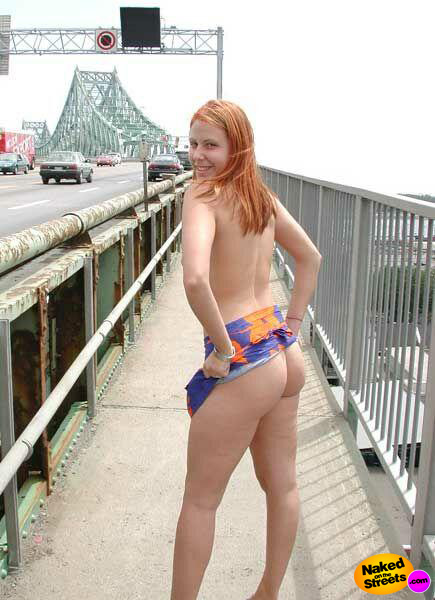 Crazy topless chick flashing her ass right on a very busy highway bridge