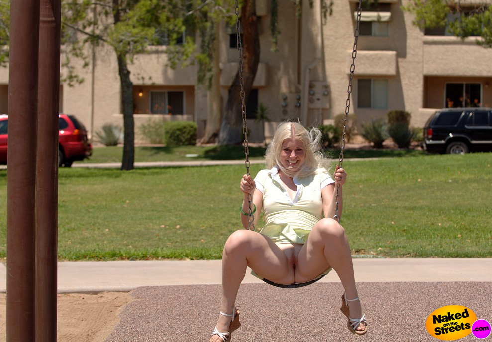 Blonde chick on a swing, flashing her pussy! I wouldn't mind joining her..