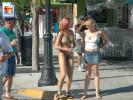 Hot chick with big bodypainted tits standing on the sidewalk!