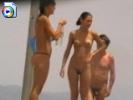 Two nude beach girls gets filmed by a perv