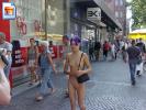 Purple haired skinny teen shows off her body in the city