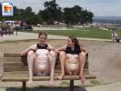 Two teen bitches flashing their pussies and titties on a park bench