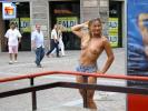 Big boobed blonde goes topless in the city