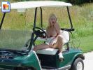 Big titted blonde girl flashes her snatch in a golf cart