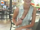 Nerdy looking chick shows her boobie in public