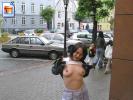 Young teen shows her boobies in the street