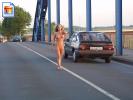 Sexy blonde vixen walks in the middle of the road