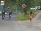 This girl walks around on the streets naked