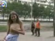 Very hot and lanky brunette massaging her tits right on the sidewalk!