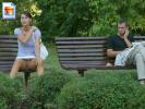 Hot teen chick flashing her juicy pussy on a park bench with dude watching