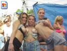 Three girls show off their boobs at a festival